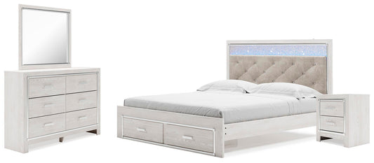 Cama Altyra King tapizada con almacenaje, tocador con espejo y mesita de noche.