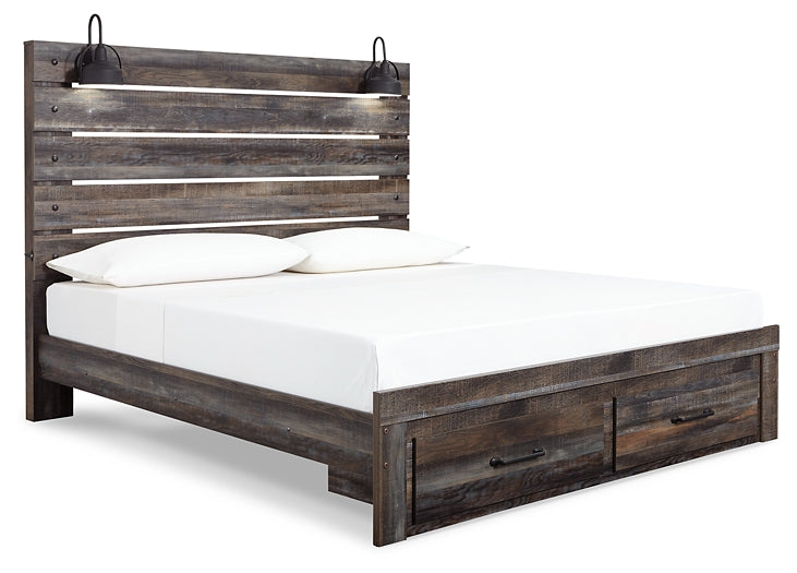 Cama Drystan tamaño King con cabecero y almacenaje, tocador con espejo, cómoda y mesita de noche.