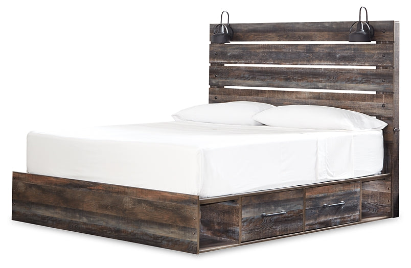 Cama Drystan tamaño King con cuatro cajones, tocador con espejo, cómoda y mesita de noche.