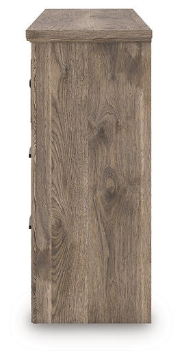 Cómoda Rusticott de siete cajones