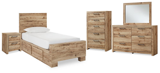 Cama individual Hyanna con almacenaje, tocador con espejo, cómoda y mesita de noche.