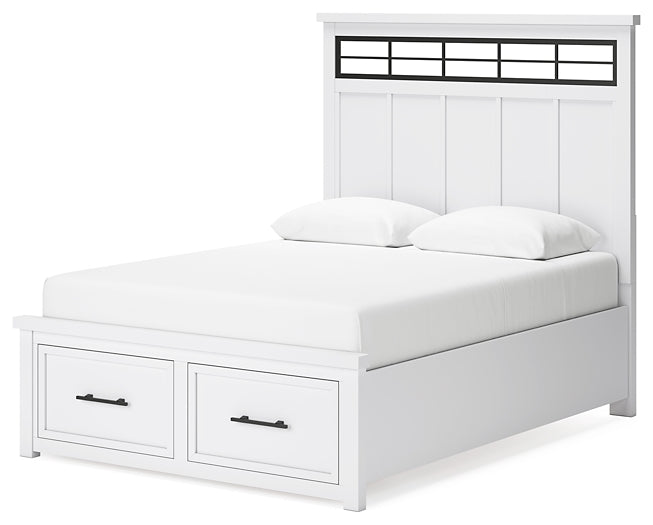 Cama Ashbryn Queen con cabecero, tocador con espejo y mesita de noche.