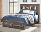Cama Drystan de tamaño completo con estantería, 2 cajones de almacenamiento, tocador con espejo, cómoda y mesita de noche.