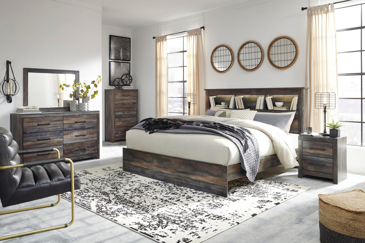 Cama Drystan King con librero, tocador con espejo, cómoda y mesita de noche.