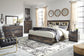 Cama Drystan King con librero, tocador con espejo, cómoda y mesita de noche.