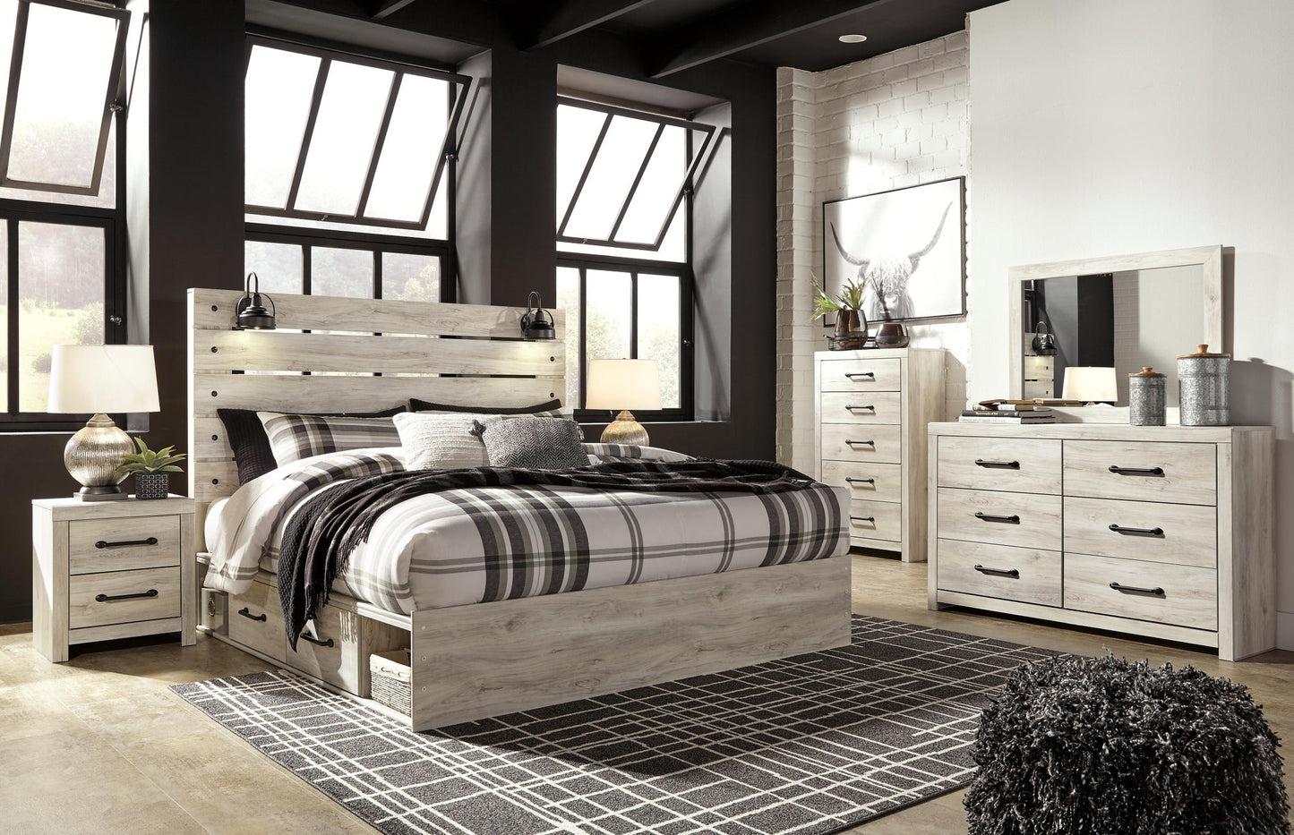 Cama Cambeck tamaño King con cabecero y cuatro cajones, tocador con espejo, cómoda y mesita de noche.