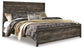 Cama Wynnlow tamaño King con cabecero, tocador con espejo, cómoda y mesita de noche