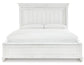 Cama Kanwyn Queen con cabecero, tocador con espejo, cómoda y mesita de noche