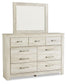 Cama Bellaby Queen con plataforma, dos cajones de almacenamiento, tocador con espejo y mesita de noche.