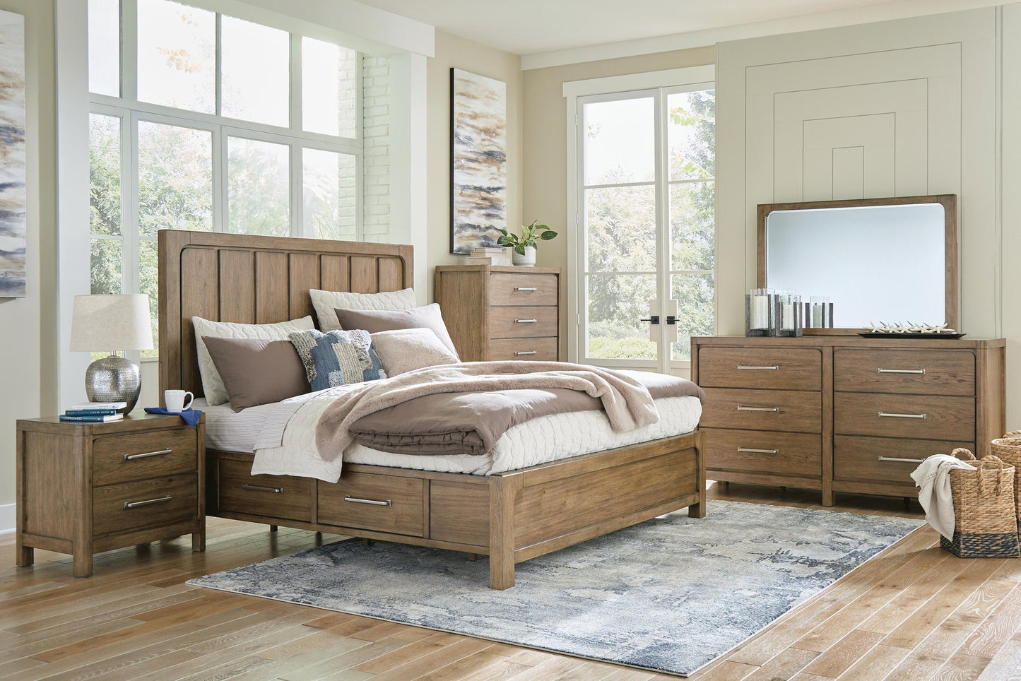 Cama Caballynn tamaño King con cabecero y almacenaje, tocador con espejo, cómoda y mesita de noche.