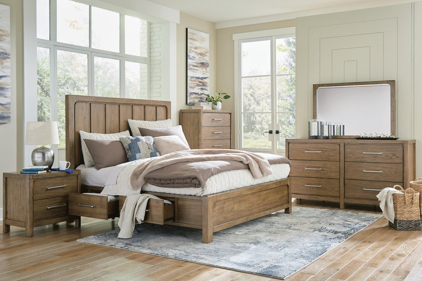 Cama Caballynn tamaño King con cabecero y almacenaje, tocador con espejo, cómoda y mesita de noche.