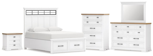 Cama Ashbryn Queen con cabecero, tocador con espejo, cómoda y mesita de noche.