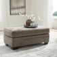 Sofá chaise longue, sillón y otomana Stonemeade