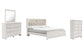 Altyra King Panel Bookcase Bed with Mirrored Dresser and Chest